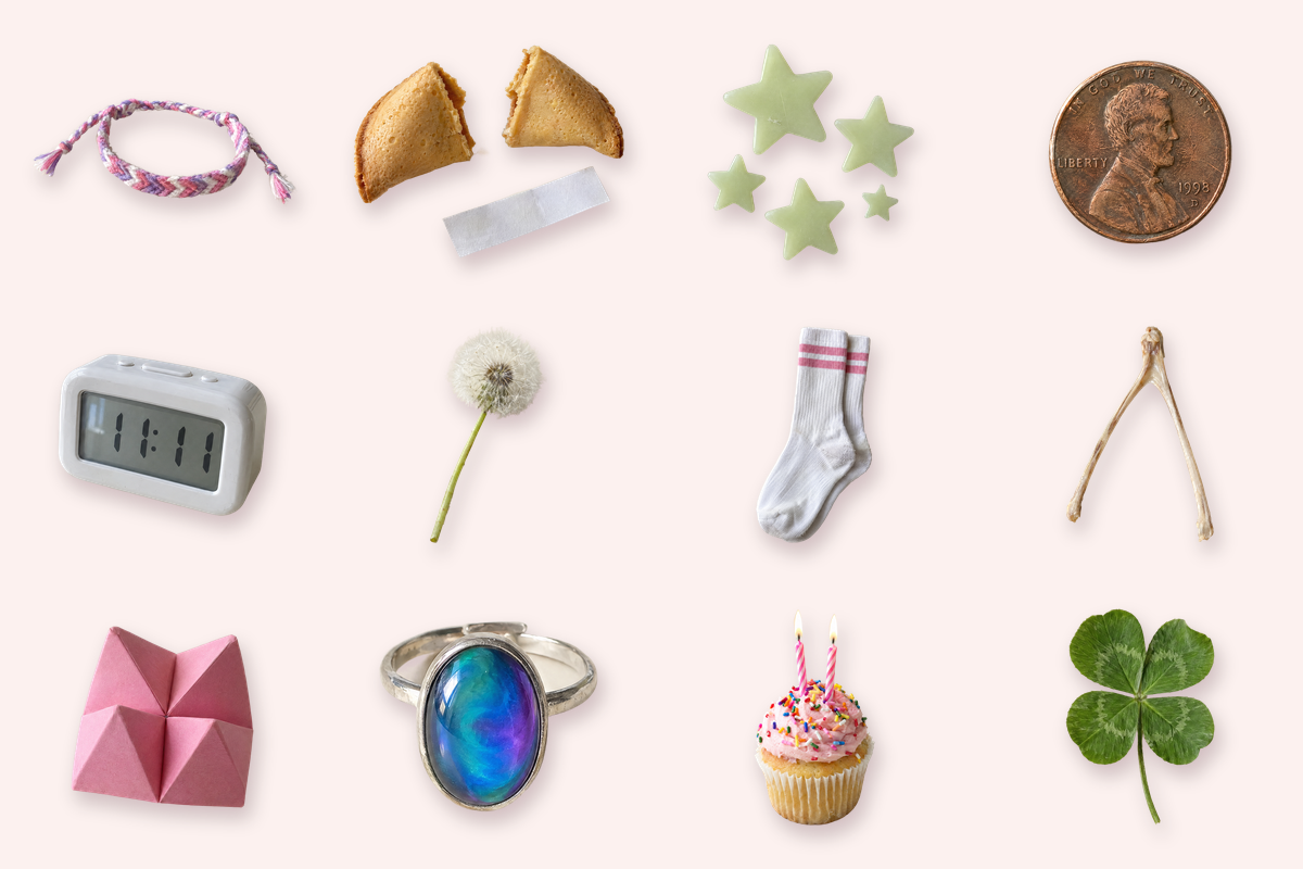twelve childhood lucky charms by zodiac sign on blush: a friendship bracelet, fortune cookie, glow stars, penny, 11:11 alarm clock, dandelion, tube socks, wishbone, cootie catcher, mood ring, birthday cupcake and four-leaf clover