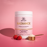 radiance collagen tub on rose studio backdrop with strawberries and gold scoop